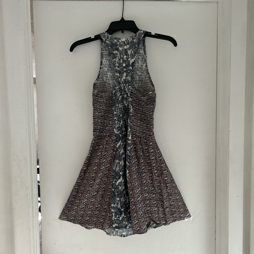 Multipattern mini a-line dress with button details in the back of neck